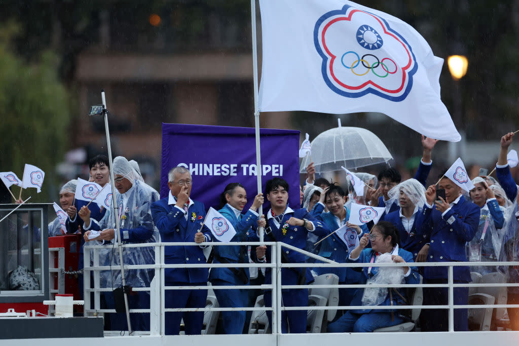 Chinese Taipei flagbearers on the team boat during the Olympics Opening Ceremony on the River Seine in Paris on July 26, 2024.<span class="copyright">Maja Hitij—Getty Images</span>