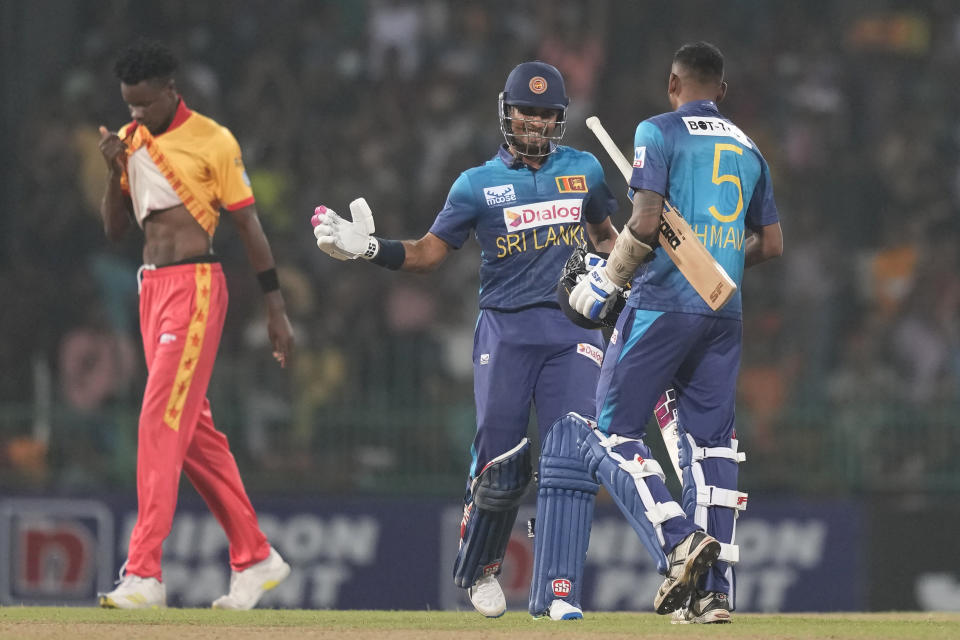 Sri Lanka's Dasun Shanaka and Dushmantha Chameera celebrate after completing the winning run in the first Twenty20 cricket match between Sri Lanka and Zimbabwe in Colombo, Sri Lanka, Sunday, Jan. 14, 2024. (AP Photo/Eranga Jayawardena)