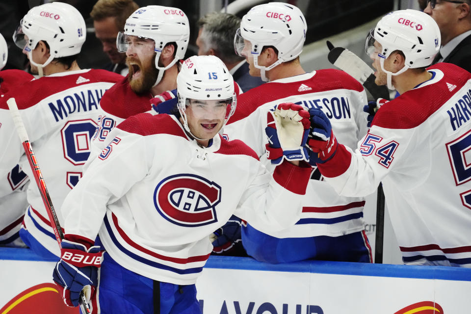 Montreal Canadiens' Alex Newhook (15) is congratulated for his goal against the Toronto Maple Leafs during the second period of an NHL hockey game Wednesday, Oct. 11, 2023, in Toronto. (Frank Gunn/The Canadian Press via AP)