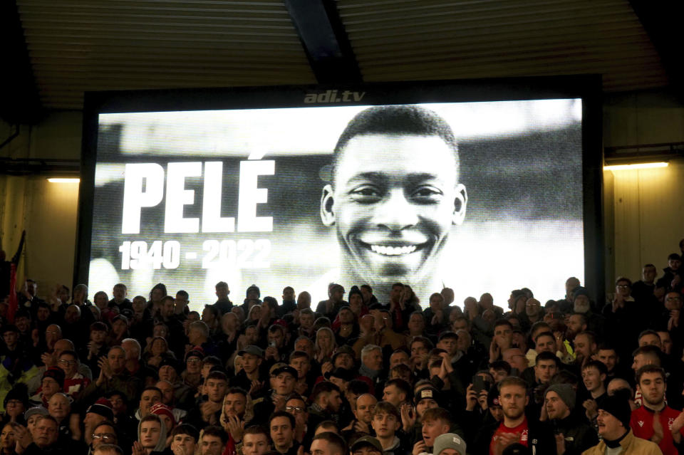 A tribute to soccer legend Pele is shown on screen ahead of the English Premier League soccer match between Nottingham Forest and Chelsea, at the City Ground, in Nottingham, England, Sunday, Jan. 1, 2023. Pele died on Thursday, Dec. 29, 2022 in Brazil at the age of 82. (Mike Egerton/PA via AP)
