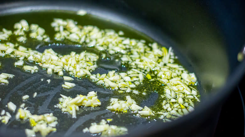 Garlic cooking in skillet