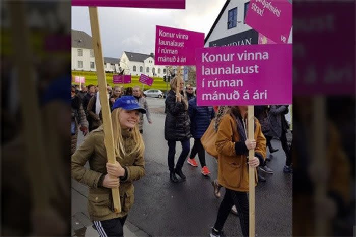 A girl marching in protest against the gender pay gap. Image: Twitter