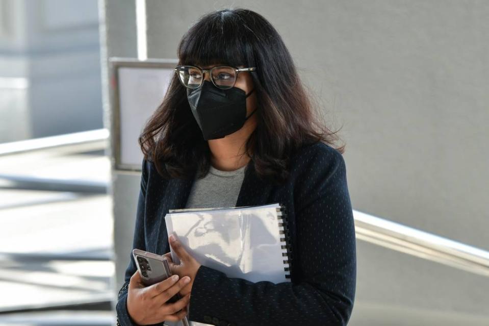 Manager of the Jalan Raja Chulan branch of AmBank, R. Uma Devi, arrives at the Kuala Lumpur High Court October 4, 2022. — Picture by Ahmad Zamzahuri