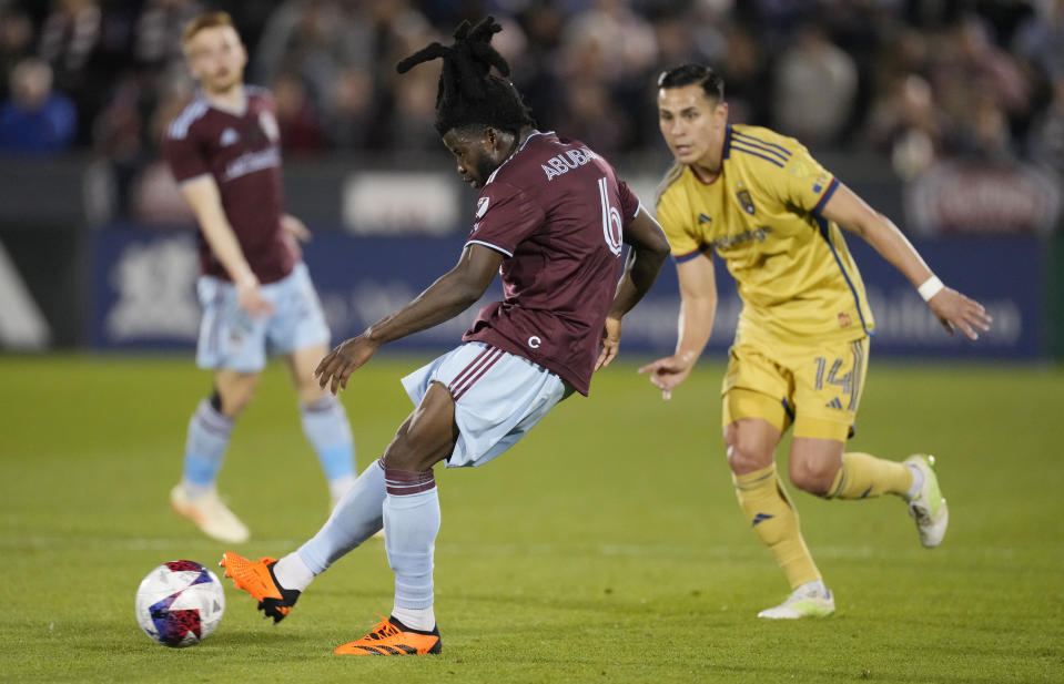 Colorado Rapids defender Lalas Abubakar, left, clears the ball as Real Salt Lake forward Rubio Rubin defends in the second half of an MLS soccer match Saturday, May 20, 2023, in Commerce City, Colo. (AP Photo/David Zalubowski)