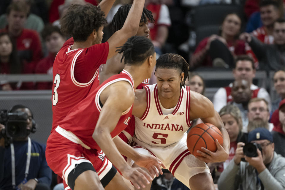 Indiana forward Malik Reneau (5) pushes against Miami (Ohio) players during the first half of an NCAA college basketball game, Sunday, Nov. 20, 2022, in Indianapolis. (AP Photo/Marc Lebryk)