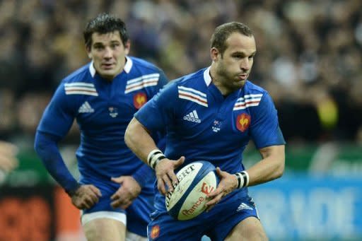 France's fly half Frederic Michalak runs with the ball during their rugby union test match against Australia at the Stade de France in Saint-Denis, north of Paris. Michalak scored 15 points as he steered France to a convincing 33-6 victory over Australia to move the home side into fourth place in the IRB rankings ahead of next month's World Cup draw