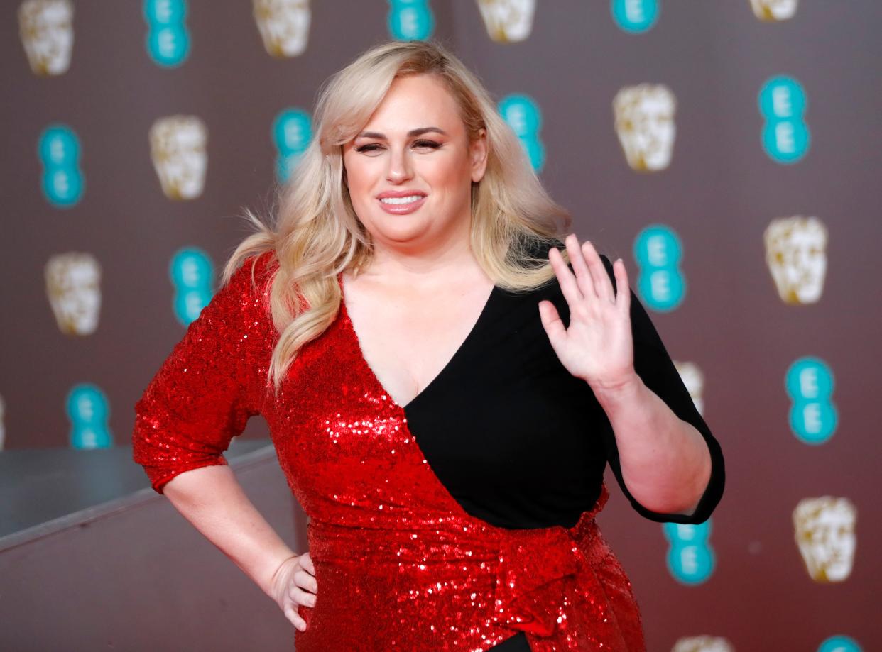 Rebel Wilson poses on the red carpet upon arrival at the BAFTA British Academy Film Awards. (Photo by TOLGA AKMEN/AFP via Getty Images)