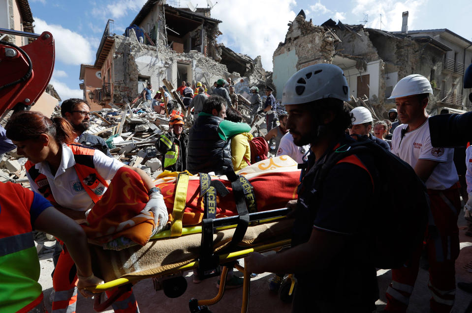 <p>A victim is pulled out of the rubble following an earthquake in Amatrice Italy, Wednesday, Aug. 24, 2016. The magnitude 6 quake struck at 3:36 a.m. (0136 GMT) and was felt across a broad swath of central Italy, including Rome where residents of the capital felt a long swaying followed by aftershocks. . (AP Photo/Alessandra Tarantino) </p>
