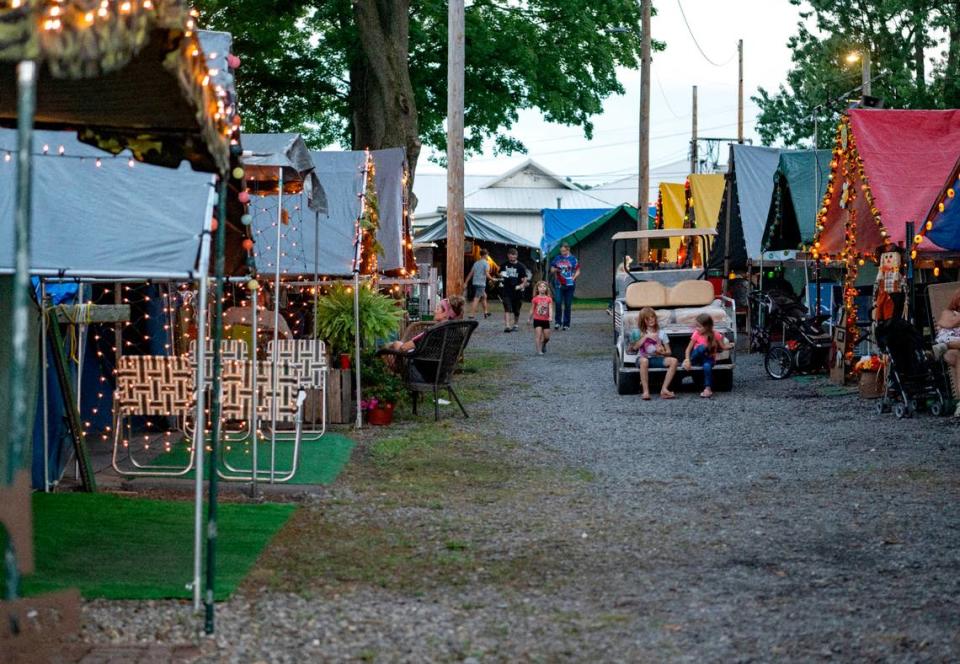 Families hang out at their tents during the Centre County Grange Fair on Monday, Aug. 22, 2022.