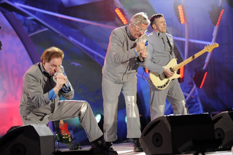 From left to right, Gerald Casale, Mark Mothersbaugh and Bob Mothersbaugh are featured in the documentary "Devo." File Photo by Matt Campbell/EPA