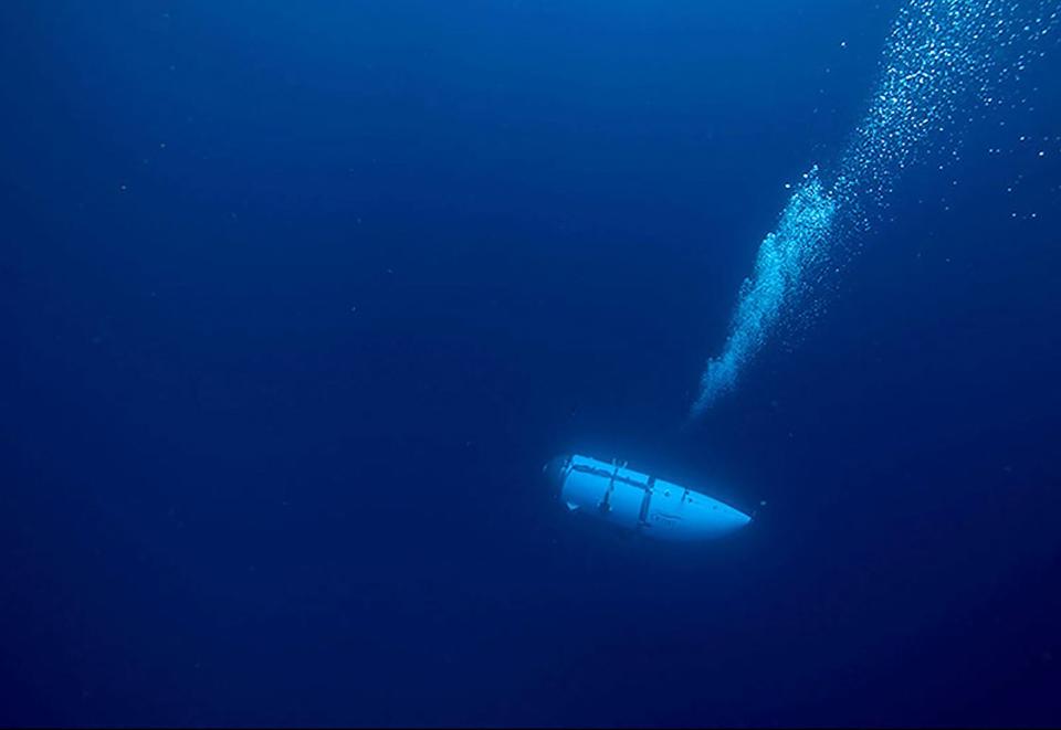 TOPSHOT - This undated image courtesy of OceanGate Expeditions, shows their Titan submersible during a descent. Rescue teams expanded their search underwater on June 20, 2023, as they raced against time to find a Titan deep-diving tourist submersible that went missing near the wreck of the Titanic with five people on board and limited oxygen. All communication was lost with the 21-foot (6.5-meter) Titan craft during a descent June 18 to the Titanic, which sits at a depth of crushing pressure more than two miles (nearly four kilometers) below the surface of the North Atlantic. (Photo by Handout / OceanGate Expeditions / AFP) / RESTRICTED TO EDITORIAL USE - MANDATORY CREDIT "AFP PHOTO / OceanGate Expeditions" - NO MARKETING NO ADVERTISING CAMPAIGNS - DISTRIBUTED AS A SERVICE TO CLIENTS (Photo by HANDOUT/OceanGate Expeditions/AFP via Getty Images) ORIG FILE ID: AFP_33KD8MC.jpg