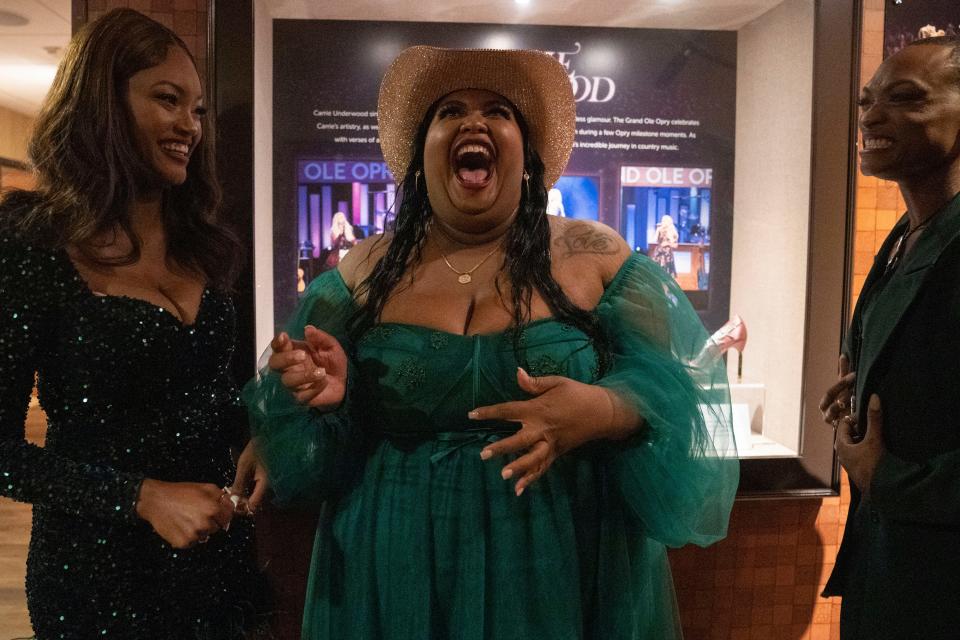 Danica Hart, center, with Chapel Hart members Devynn Hart and Trea Swindle, right, get excited backstage before their debut at the Grand Ole Opry Saturday, Sept. 17, 2022 in Nashville, Tenn.