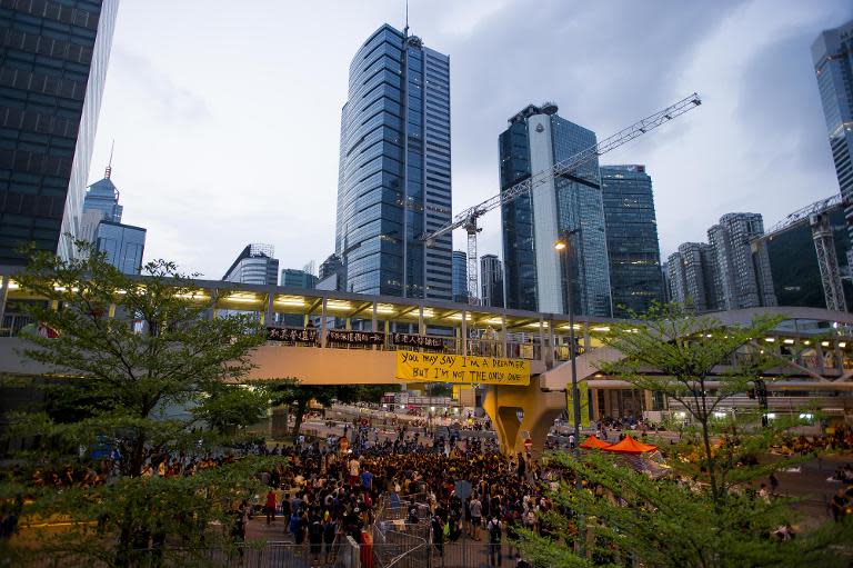 Protesters listen to a speech in Hong Kong's Admiralty district on October 2, 2014