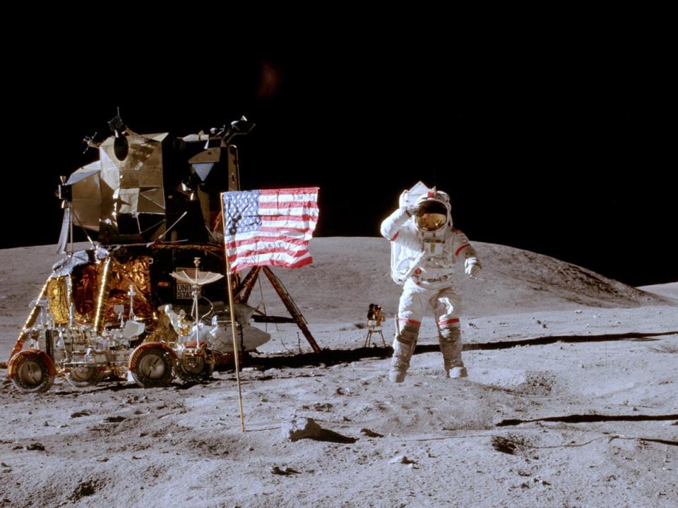 Astronaut John Young saluting the flag while jumping during the Apollo 16 mission.