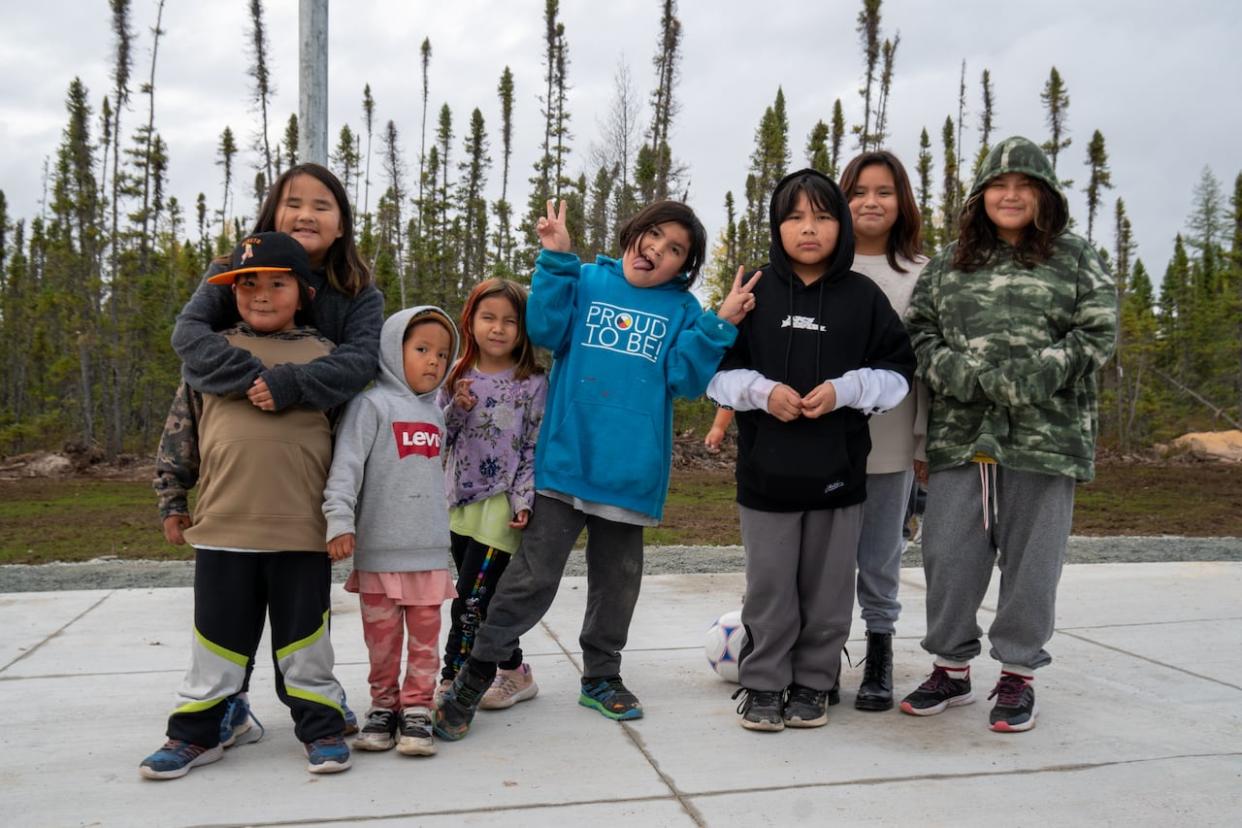 Students from Wapekeka First Nation, about 450 kilometres northeast of Sioux Lookout, Ont., hang out in the playground of the new Rev. Eleazar Winter Education Centre. The community's former school burned down in May 2015. (Sarah Law/CBC - image credit)