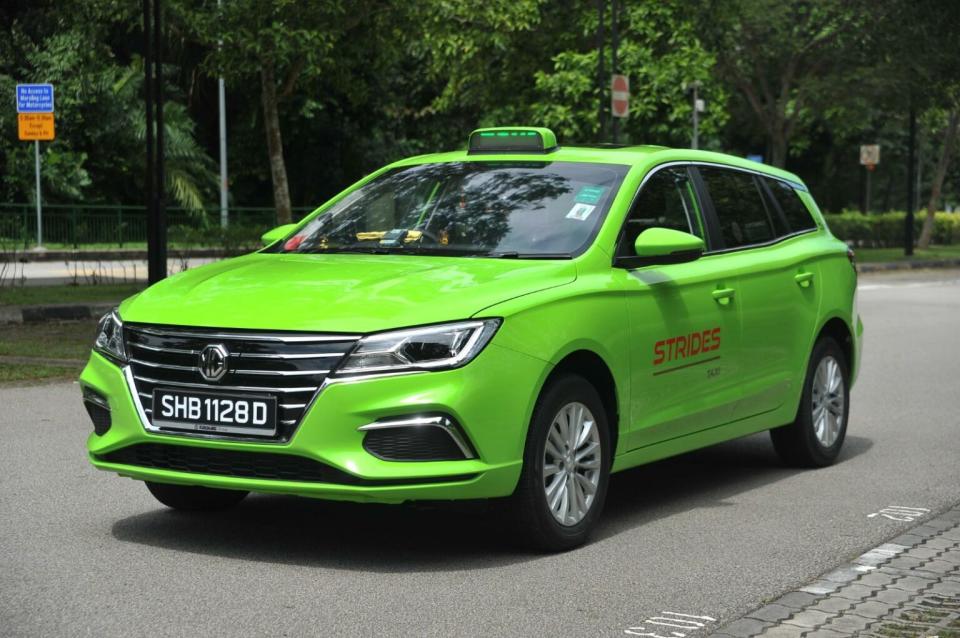 Image of a green coloured Strides taxi on the road.