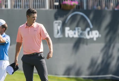 May 26, 2018; Fort Worth, TX, USA; Justin Rose walks off the course after putting in the eighteenth hole during the third round of the Fort Worth Invitational golf tournament at Colonial Country Club. Mandatory Credit: Jerome Miron-USA TODAY Sports