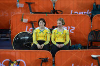 Australia's Anna Meares (left) and Kaarle McCulloch sits together before ride in the Women's Team Sprint bronze medal race at the Olympic Games in London, Thursday, Aug. 2, 2012. (AAP Image/Dave Hunt) NO ARCHIVING