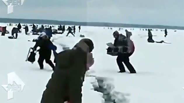 The frozen lake located in the Magadan Oblast began to crack while hundreds of fisherman were on top of it. Photo: ren.tv
