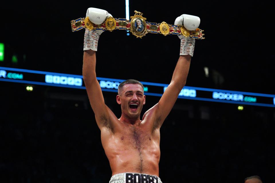Cullen celebrates winning the British and Commonwealth super-middleweight title (PA)