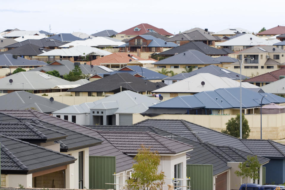 Residential houses in a Rockingham Suburb - Western Australia. Typical of modern life this new development shows suburban sprawl as a landscape of roof tops. 