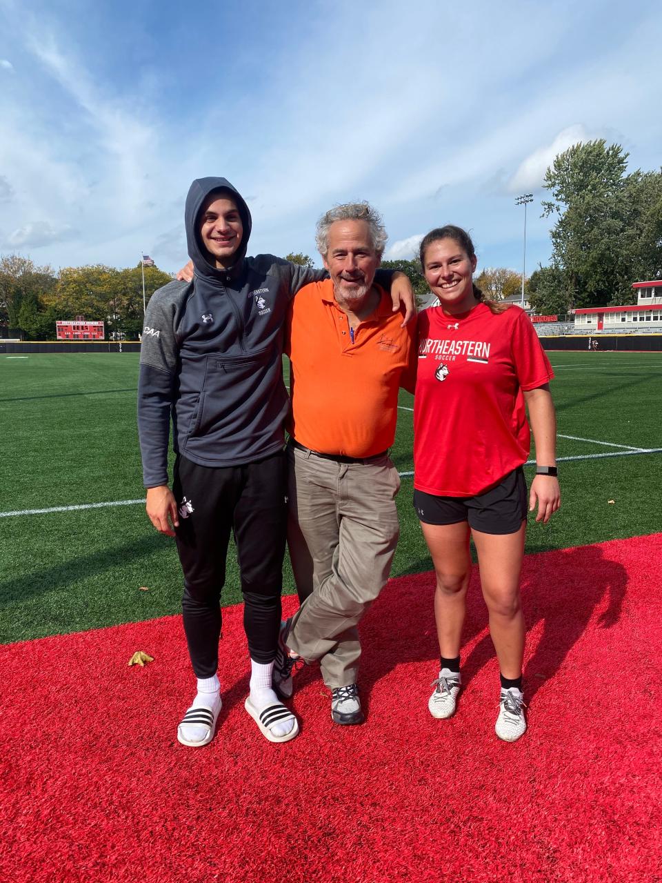 Jeffrey Levin with Jacques Baldwin and Ang Friel, both soccer players at Northeastern University.