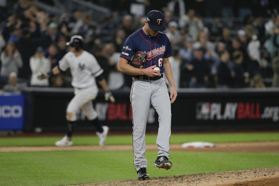 Minnesota Twins relief pitcher Cody Stashak (61) reacts after giving up a solo home run to New York Yankees' DJ LeMahieu during the sixth inning of Game 1 of an American League Division Series baseball game, Friday, Oct. 4, 2019, in New York. (AP Photo/Seth Wenig)