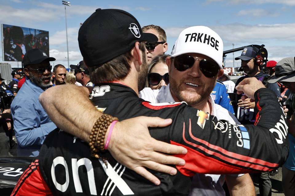 SONOMA, CALIFORNIA - JUNE 12: Trackhouse Racing team co-owner Justin Marks congratulates Daniel Suarez, driver of the #99 Onx Homes/Renu Chevrolet, after winning the NASCAR Cup Series Toyota/Save Mart 350 at Sonoma Raceway on June 12, 2022 in Sonoma, California. (Photo by Chris Graythen/Getty Images) | Getty Images