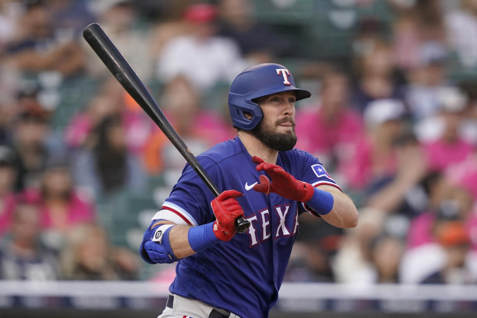 Texas Rangers' David Dahl watches his RBI double to right field during the fourth inning of a baseball game against the Detroit Tigers, Wednesday, July 21, 2021, in Detroit. (AP Photo/Carlos Osorio)