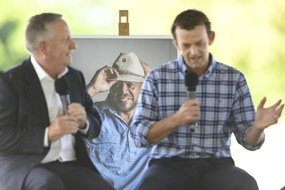 Ian Healy and Adam Gilchrist, pictured here speaking about Andrew Symonds at his public memorial.