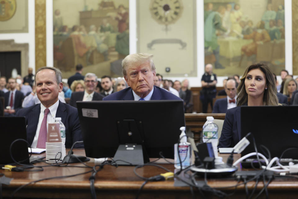 Former President Donald Trump, center, appears in court Monday, Oct 2, 2023, in New York. (Brendan McDermid/Pool Photo via AP)