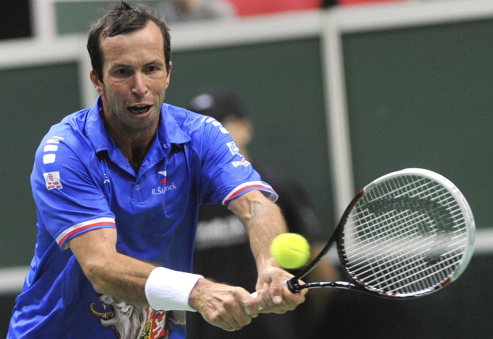 Radek Stepanek from the Czech Republic returns the ball to Robin Haase from the Netherlands during their opening single of the tennis Davis Cup first round match in Ostrava, Friday, Jan. 31, 2014. (AP Photo/CTK, Jaroslav Ozana) SLOVAKIA OUT