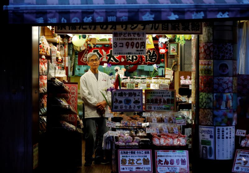FILE PHOTO: The Wider Image: From the streets of Tokyo, 22 residents weigh up the Olympic Games
