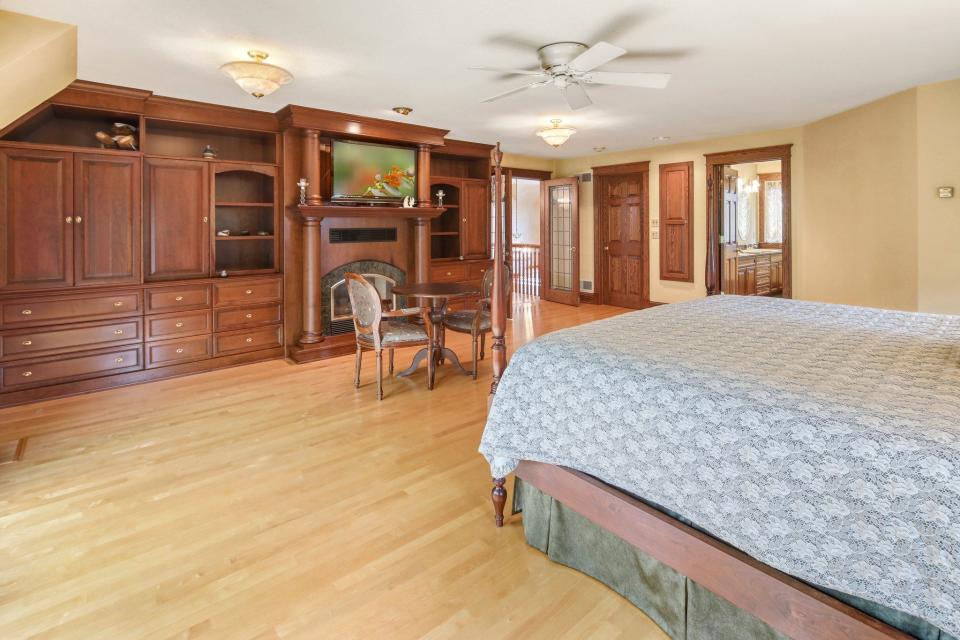The master bedroom sits on the second story and features a private balcony overlooking the grounds. The room is spacious and offers plenty of area for relaxing and sleeping.