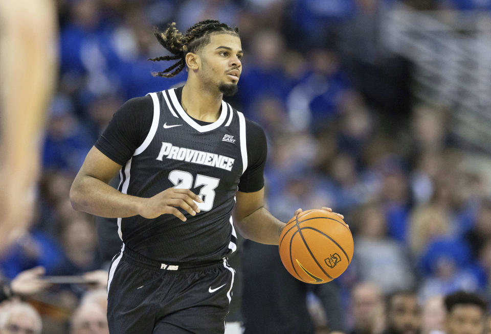 FILE- Providence's Bryce Hopkins (23) brings the ball up court during the first half of an NCAA college basketball game against Creighton, Saturday, Jan. 14, 2023, in Omaha, Neb. Hopkins is leading the Friars in scoring entering Friday's NCAA Tournament matchup against his former school Kentucky. (AP Photo/Rebecca S. Gratz, File)