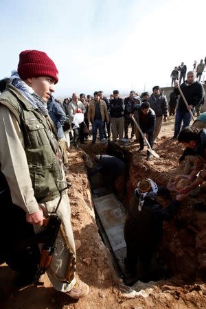 Mourners attend a funeral of victims who were killed in a bomb attack at the offices of the Democratic Party of Iranian Kurdistan (PDKI) in Koy Sanjak, east of Erbil, Iraq, December 21, 2016. REUTERS/Azad Lashkari