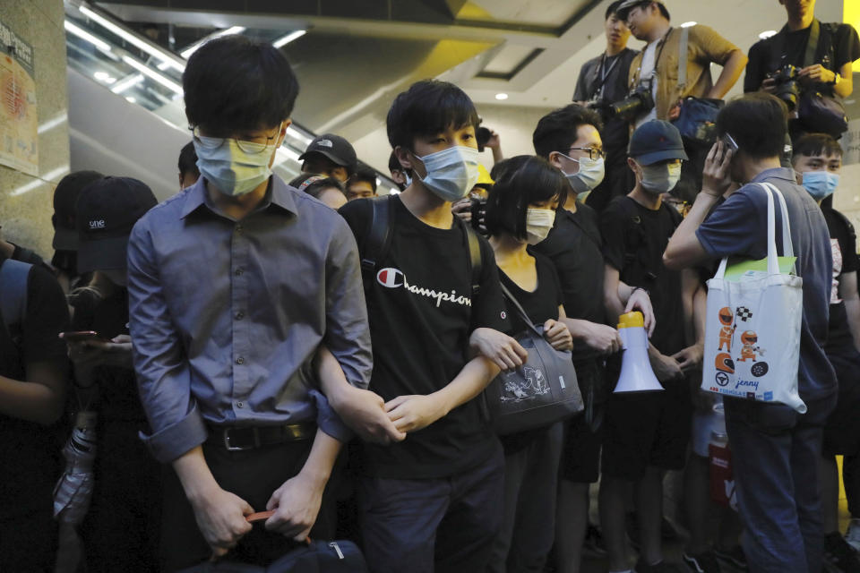 Protesters block the lobby of the Hong Kong Revenue Tower in Hong Kong on Monday, June 24, 2019. Hong Kong has been rocked by major protests for the past two weeks over legislative proposals that many view as eroding the territory's judicial independence and, more broadly, as a sign of Chinese government efforts to chip away at the city's freedoms. (AP Photo/Kin Cheung)