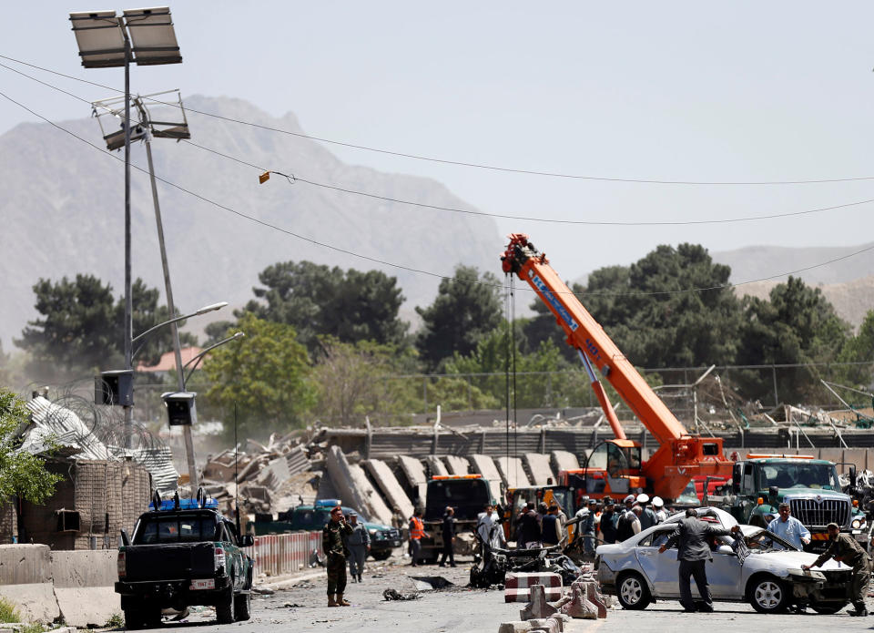 <p>Afghan officials inspect at the site of a blast in Kabul, Afghanistan, May 31, 2017. (Mohammad Ismail/Reuters) </p>