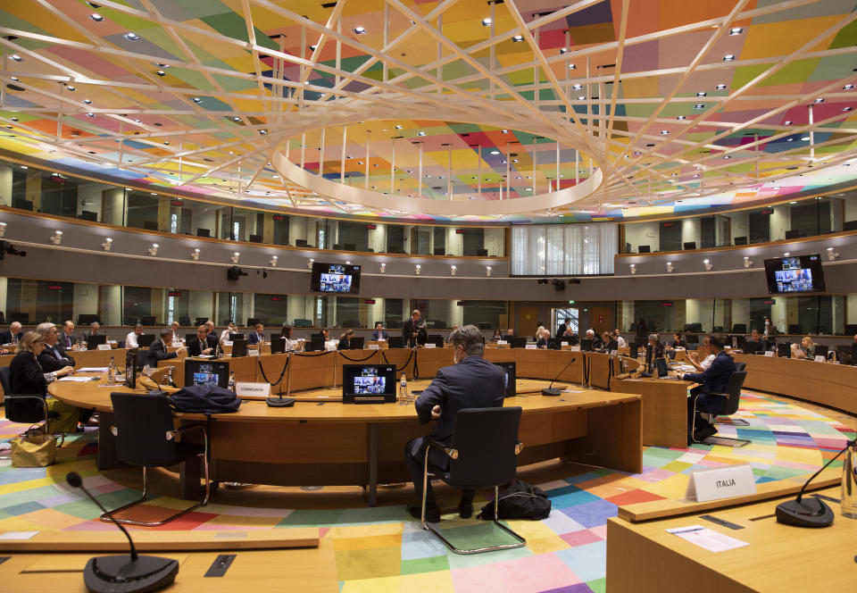 Delegation members of EU foreign ministers gather for a roundtable prior to a videoconference meeting between EU foreign ministers and U.S. Secretary of State Mike Pompeo at the European Council building on Monday, June 15, 2020. The talks, which were to focus on China, developments in the Middle East and trans-Atlantic relations, come at a time of simmering tensions between the Brussels and Washington, notably over trade differences and the Iran nuclear agreement. (AP Photo/Virginia Mayo, Pool)