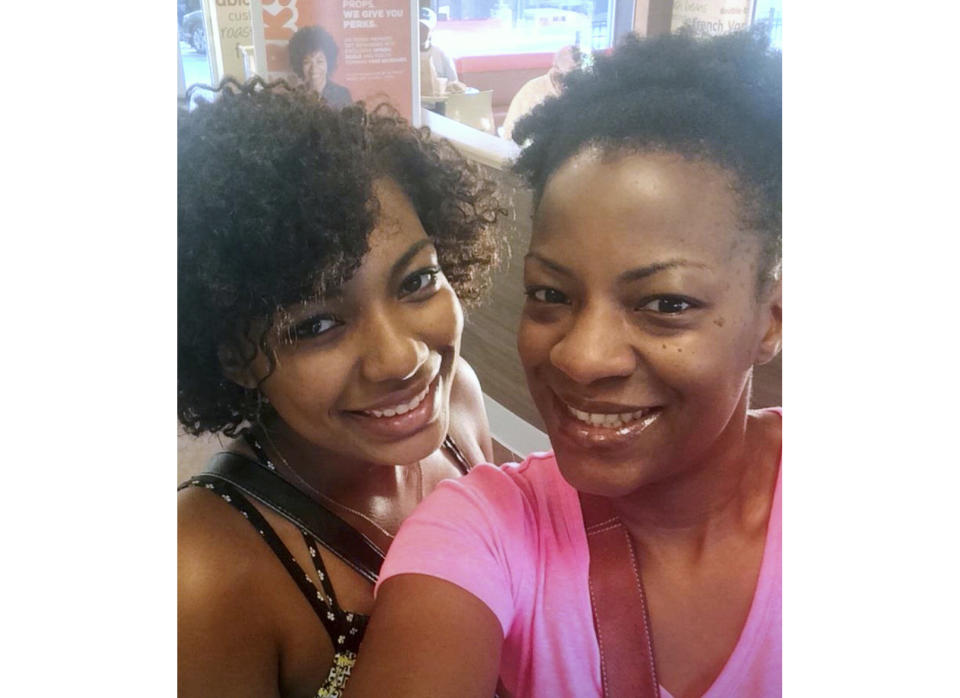 In this August 2015 photo provided by Nerdwallet, Taje Perkins, left, poses for a photo with her mother Takiia Anderson on her first day at Spelman College in Atlanta. Today, Anderson’s student debt is long gone. She has nearly $500,000 in retirement savings, and her daughter, Taje Perkins, finished her third year at Spelman College in Atlanta with no student loans to cover its nearly $30,000 per year in tuition and fees. (Nerdwallet via AP)