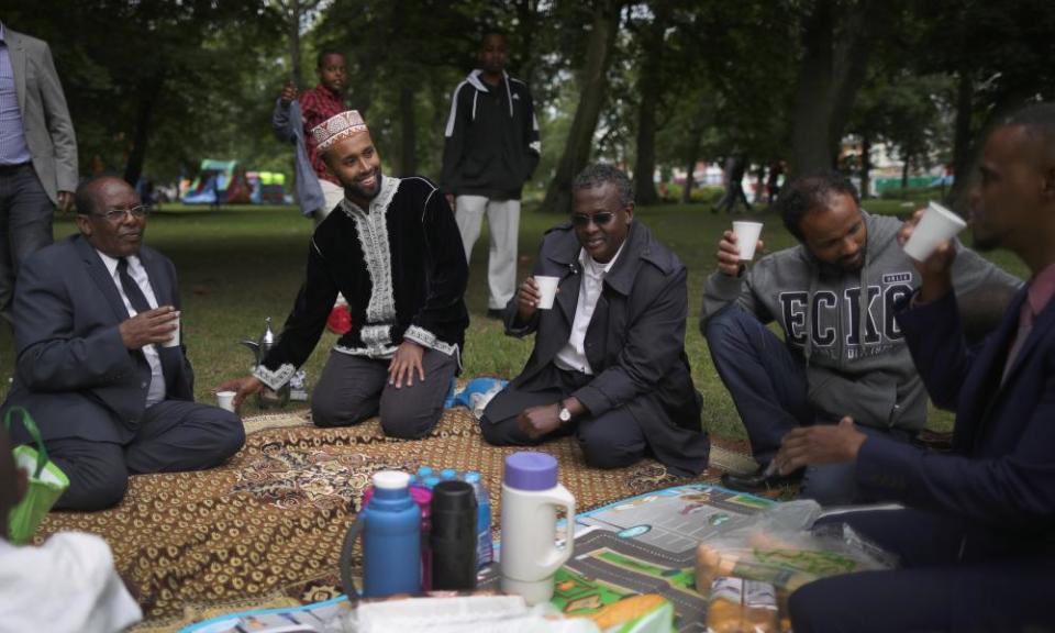 Members of the Somali community at the Birmingham Eid festival enjoy a picnic.