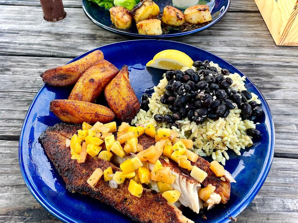 Blackened redfish with mango salsa and Caribbean jerk scallops from Turtle Shack Cafe in Flagler Beach.