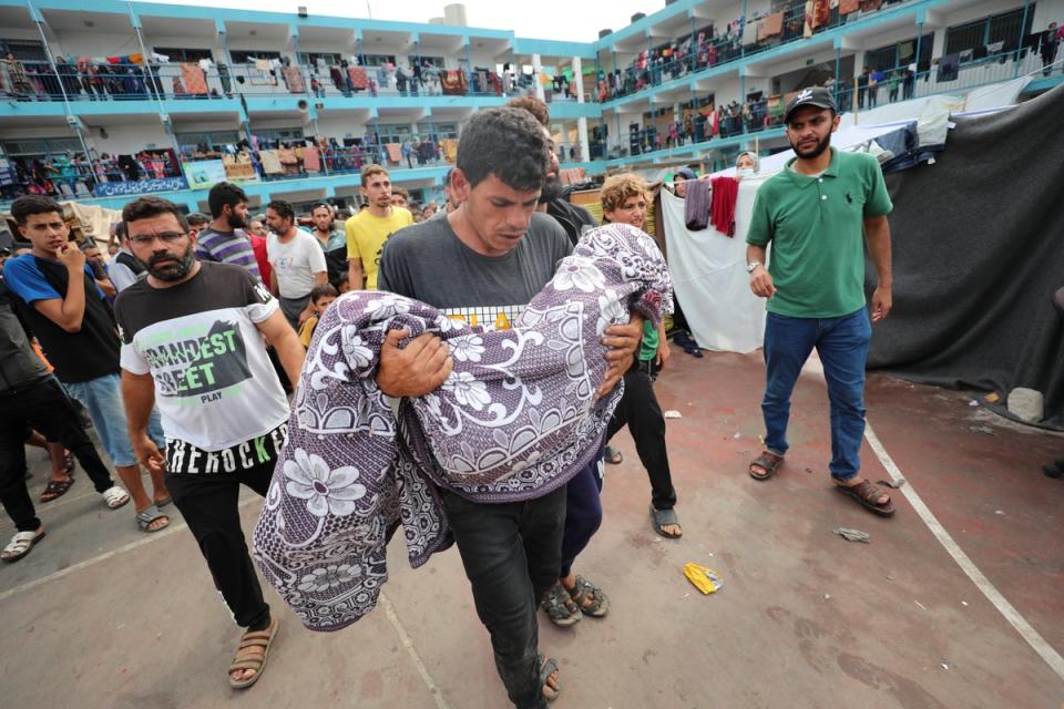 Palestinians carry a child killed in the Israeli bombardment of the Gaza Strip (Copyright 2023 The Associated Press. All rights reserved.)