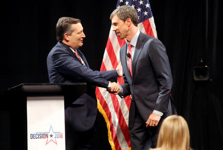 Republican U.S. Senator Ted Cruz and Democratic U.S. Representative Beto O'Rourke (R) shake hands prior to their first debate for Texas U.S. Senate seat at the Southern Methodist University in Dallas, Texas, U.S., September 21, 2018. Tom Fox/The Dallas Morning News/Pool via REUTERS