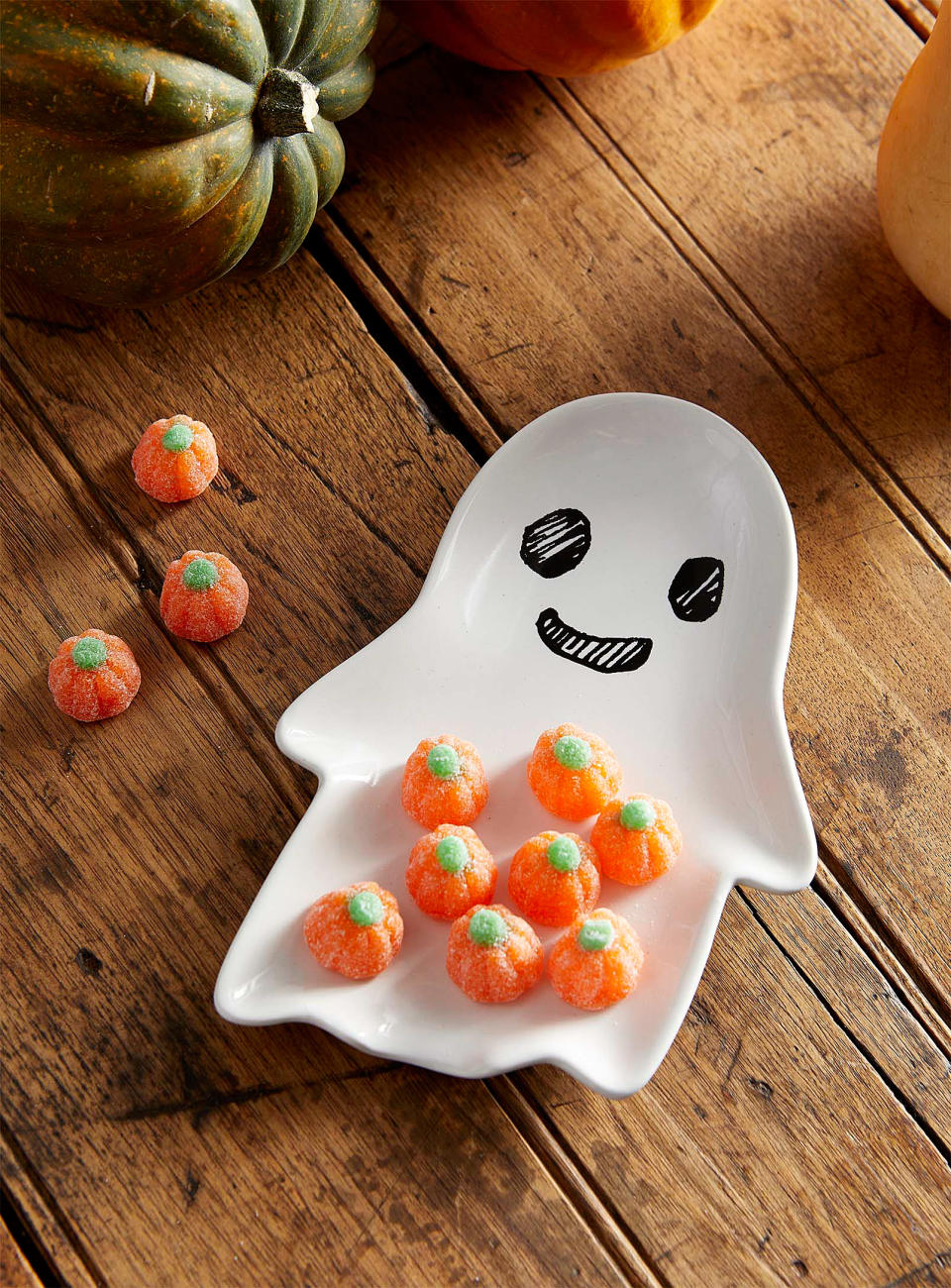 the ghost plate with pumpkin candies on it