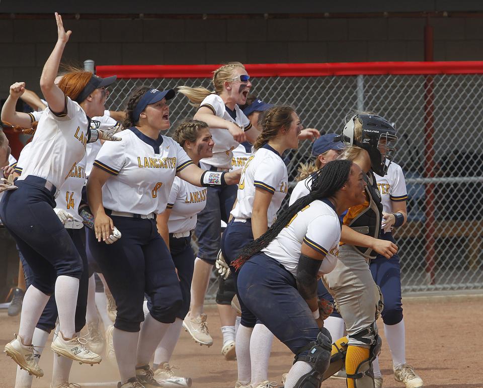 Lancaster begins to celebrate after Reese Poston homered with two outs in the bottom of the seventh inning to beat Gahanna Lincoln 1-0 in a Division I regional semifinal May 25 at Centerburg.