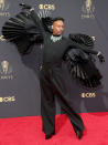 <p>Porter told <a href="https://people.com/style/billy-porter-walks-2021-emmy-awards-red-carpet-black-wings/" rel="nofollow noopener" target="_blank" data-ylk="slk:PEOPLE;elm:context_link;itc:0;sec:content-canvas" class="link ">PEOPLE</a> that his wings were originally "supposed to go all the way to the floor but it didn't work out." According to these stunning photos, we think it worked out just fine.</p>