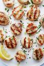 <p>Scallops will make you feel fancy no matter what—and they're so easy to grill. When seasoned with some salt, pepper, and chilli flakes, they're pure gold. </p><p>Get the <a href="https://www.delish.com/uk/cooking/recipes/a32821279/best-grilled-scallops-recipe/" rel="nofollow noopener" target="_blank" data-ylk="slk:Grilled Scallops;elm:context_link;itc:0;sec:content-canvas" class="link ">Grilled Scallops</a> recipe.</p>