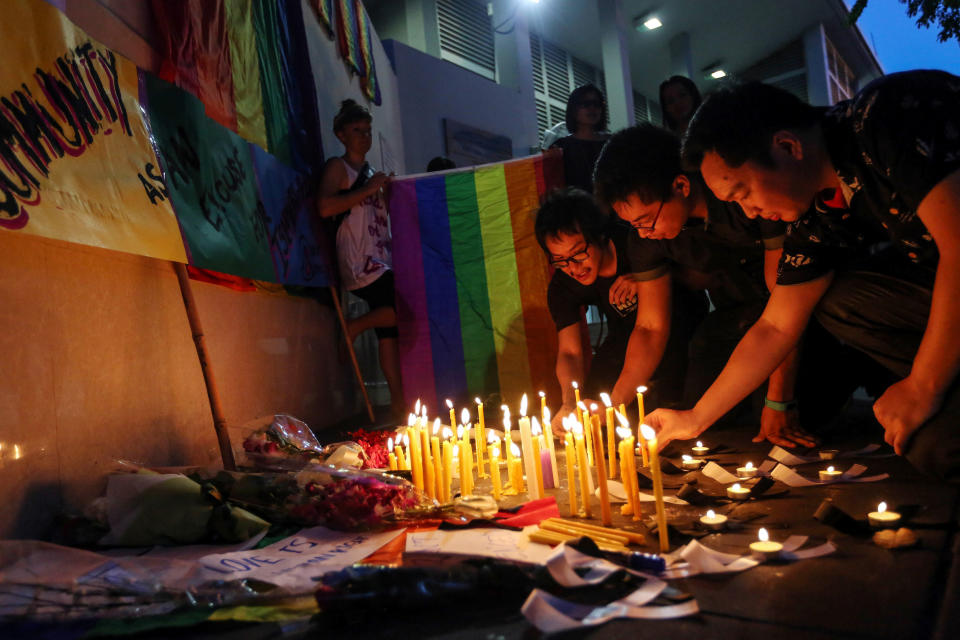 People light candles during a vigil for the attack at the gay club in Orlando, on Monday, June 13, in Bangkok, Thailand.&nbsp;