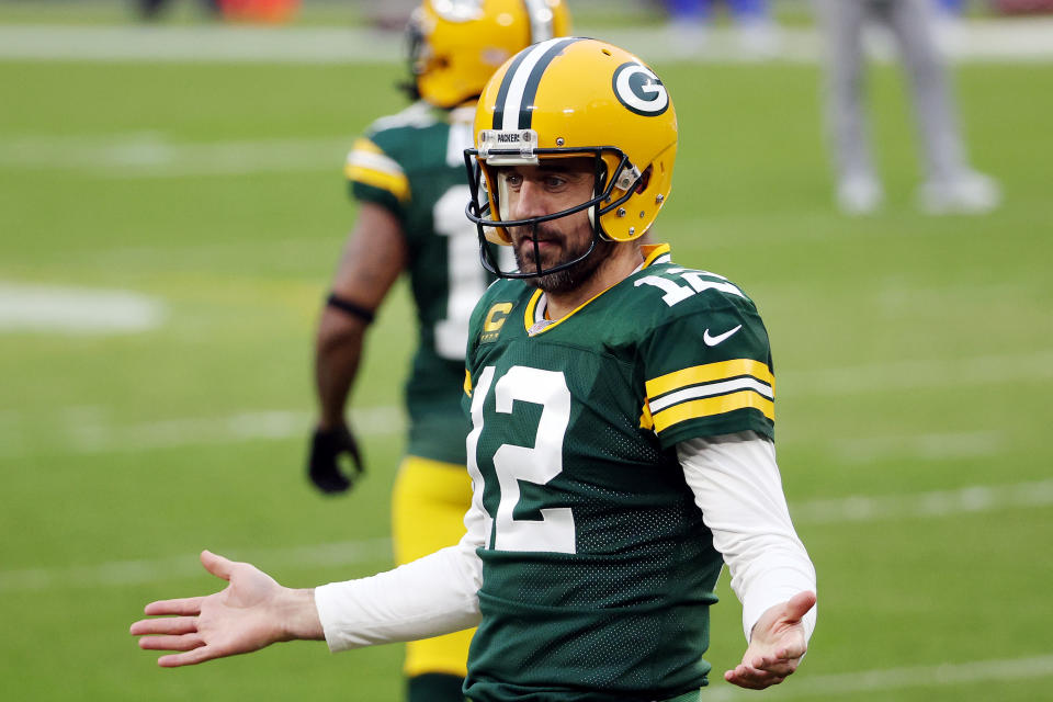 GREEN BAY, WISCONSIN - JANUARY 16: Aaron Rodgers #12 of the Green Bay Packers reacts before the NFC Divisional Playoff game against the Los Angeles Rams at Lambeau Field on January 16, 2021 in Green Bay, Wisconsin. (Photo by Dylan Buell/Getty Images)